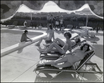 Four women mingle and lounge in the sun at Bay Pointe Condominiums in Tampa, Florida, D by Skip Gandy
