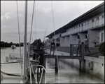 Four friends unload fishing rods at Bay Pointe Condominiums in Tampa, Florida, B by Skip Gandy