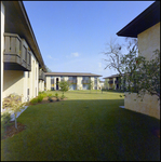 A courtyard sits between four buildings at Bay Cove Apartments in Clearwater, Florida, B