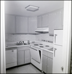 An empty kitchen with the oven door ajar at Bayshore Towers Condominiums in Tampa, Florida in, B