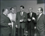 Five men in the Better Home Heat Council smile animatedly in Tampa, Florida