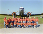 Group Photo at the Lakeland Air Center, with Airplane Behind, A by Skip Gandy