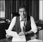 Jerry Bowmer Posing with Papers at his Desk, A by Skip Gandy