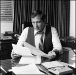 Jerry Bowmer Reading Papers at his Desk, A by Skip Gandy