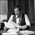 Jerry Bowmer Reading Papers at his Desk, B by Skip Gandy