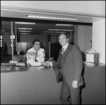 Jerry Bowmer Posing by Shaking Hands with Courthouse Officer by Skip Gandy