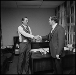 Jerry Bowmer Shaking Hands with Male Employee, A by Skip Gandy