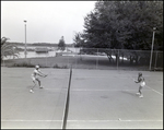 Man and Woman Playing Tennis at Brandon Sports and Aquatic Center, Brandon, Florida, D by Skip Gandy