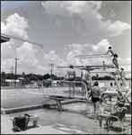 Swimmers Jumping Off Diving Board at Brandon Sports and Aquatic Center, Brandon, Florida, B by Skip Gandy