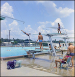 Swimmers Jumping Off Diving Board at Brandon Sports and Aquatic Center, Brandon, Florida, E by Skip Gandy