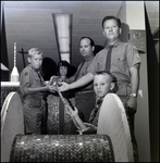 Boys Scouts and Boy Scout Leaders Roll a Wooden Spool of Cord Made of Pennies, B by Skip Gandy