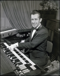 Musician Playing Multiple Pianos, A by Skip Gandy