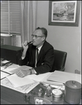 Edgar T. McCleary, Headmaster of Berkeley Preparatory School, Smoking a Pipe at His Desk, Tampa, Florida, A by Skip Gandy