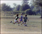 Children Playing Soccer on a Field, Tampa, Florida, A by Skip Gandy