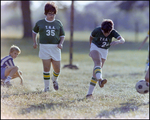 Children Playing Soccer on a Field, Tampa, Florida, B by Skip Gandy