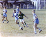 Children Playing Soccer on a Field, Tampa, Florida, J by Skip Gandy