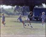 Children Playing Soccer on a Field, Tampa, Florida, U by Skip Gandy