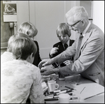 Faculty Member Conducting an Experiment With Students, Berkeley Preparatory School, Tampa, Florida, A by Skip Gandy