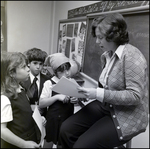 Faculty Member Helping Young Students, Berkeley Preparatory School, Tampa, Florida, A by Skip Gandy