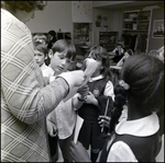 Faculty Member Helping Young Students, Berkeley Preparatory School, Tampa, Florida, B by Skip Gandy