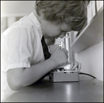 Student Looking Through Microscope, Berkeley Preparatory School, Tampa, Florida, B by Skip Gandy