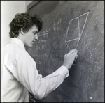 Student Writing on Chalkboard, Berkeley Preparatory School, Tampa, Florida, A by Skip Gandy