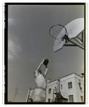 A Student Shoots His Shot in an Outdoor Boys Basketball Game, Berkeley Preparatory School, Tampa, Florida, B by Skip Gandy