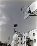 A Student Shoots His Shot in an Outdoor Boys Basketball Game, Berkeley Preparatory School, Tampa, Florida, C by Skip Gandy