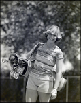 A Student Smiles Holding a Set of Golf Clubs, Berkeley Preparatory School, Tampa, Florida, G by Skip Gandy