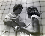 Two Tennis Players Giggle Behind the Net, Berkeley Preparatory School, Tampa, Florida, E by Skip Gandy