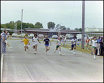 Five Boys Run Track Before an Audience, Berkeley Preparatory School, Tampa, Florida by Skip Gandy