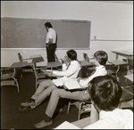 Students Watch an Instructor Solve a Math Problem at Berkeley Preparatory School in Tampa, Florida by Skip Gandy