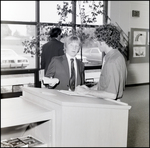 A Student Consults With an Instructor in the Library at Berkeley Preparatory School in Tampa, Florida by Skip Gandy