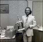 A Man Poses With a Soccer Trophy at Berkeley Preparatory School in Tampa, Florida by Skip Gandy