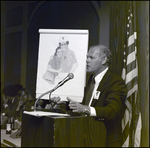 Gordon French of the Berkeley Preparatory School Dads Club Holds up an Illustration in Tampa, Florida, B by Skip Gandy