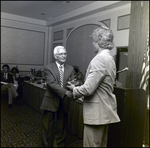 A Man Shakes a Student's Hand While Presenting an Award at Berkeley Preparatory School in Tampa, Florida by Skip Gandy