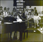 A Student Plays Piano for an Audience at Berkeley Preparatory School in Tampa, Florida by Skip Gandy