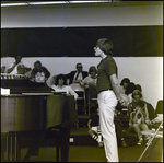 A Student Sings With a Piano Accompaniment for an Audience at Berkeley Preparatory School in Tampa, Florida by Skip Gandy