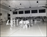 Cheerleaders Surround a Team Huddle During a Basketball Game at Berkeley Preparatory School in Tampa, Florida by Skip Gandy