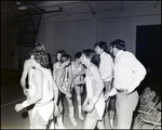 Two Boy's Basketball Coaches Confer With Their Team at Berkeley Preparatory School in Tampa, Florida by Skip Gandy