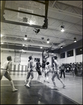 An Opposing Player Attempts a Jump Shot During a Boy's Basketball Game at Berkeley Preparatory School in Tampa, Florida, A by Skip Gandy