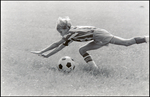 A Player Dives Over the Ball During a Children's Soccer Game at Berkeley Preparatory School in Tampa, Florida by Skip Gandy