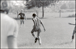 A Player Dribbles the Ball During a Children's Soccer Game at Berkeley Preparatory School in Tampa, Florida by Skip Gandy