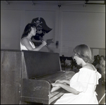 Two Students Sing and Play Piano During the June Commencement at Berkeley Preparatory School in Tampa, Florida, A by Skip Gandy