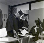 A School Official Reviews Instructions Prior to Commencement at Berkeley Preparatory School in Tampa, Florida by Skip Gandy