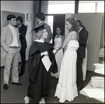 A School Official Speaks Animatedly With a Graduating Student Before Commencement at Berkeley Preparatory School in Tampa, Florida by Skip Gandy