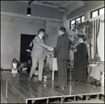 A Graduate Shakes Hands With an Official During Commencement at Berkeley Preparatory School in Tampa, Florida, A by Skip Gandy