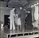 A Graduate Shakes Hands With an Official During Commencement at Berkeley Preparatory School in Tampa, Florida, C by Skip Gandy