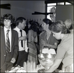 Students and Parents Mingle by the Punch Bowl After Commencement at Berkeley Preparatory School in Tampa, Florida by Skip Gandy