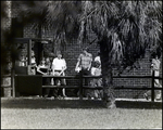 Students Hold Their Textbooks While Exiting a Classroom at Berkeley Preparatory School in Tampa, Florida, A by Skip Gandy